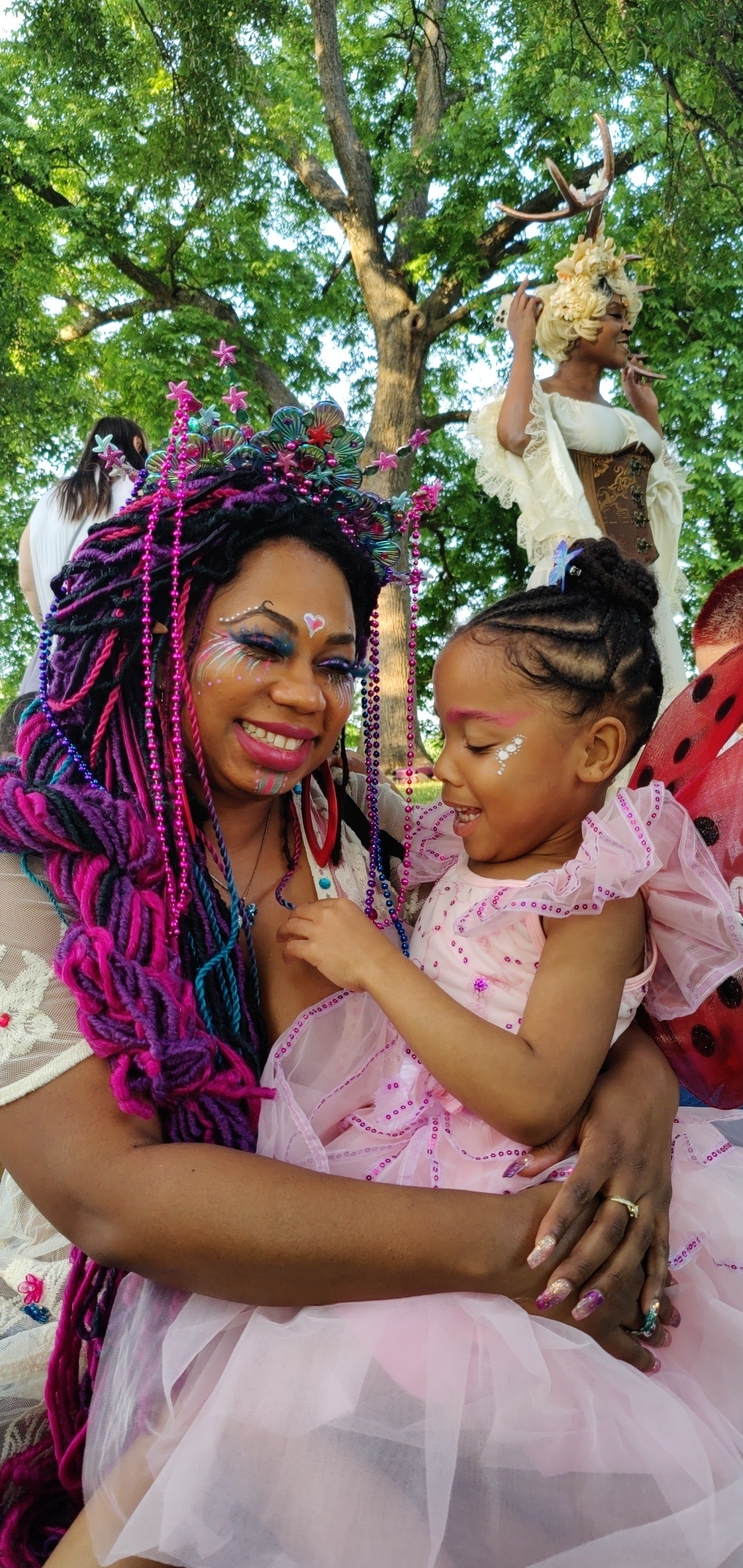 Clover Jené Mermaid playing with her niece at the Black FaeDay Picnic. Black fantasy community.